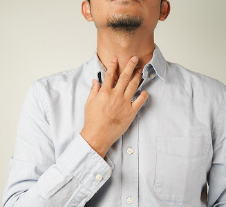 Man holding his throat