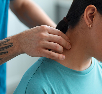 Clinician examining a patient's neck