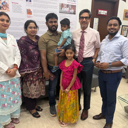 Dr. Sumit Mrig with a patient's family and members of his clinical team
